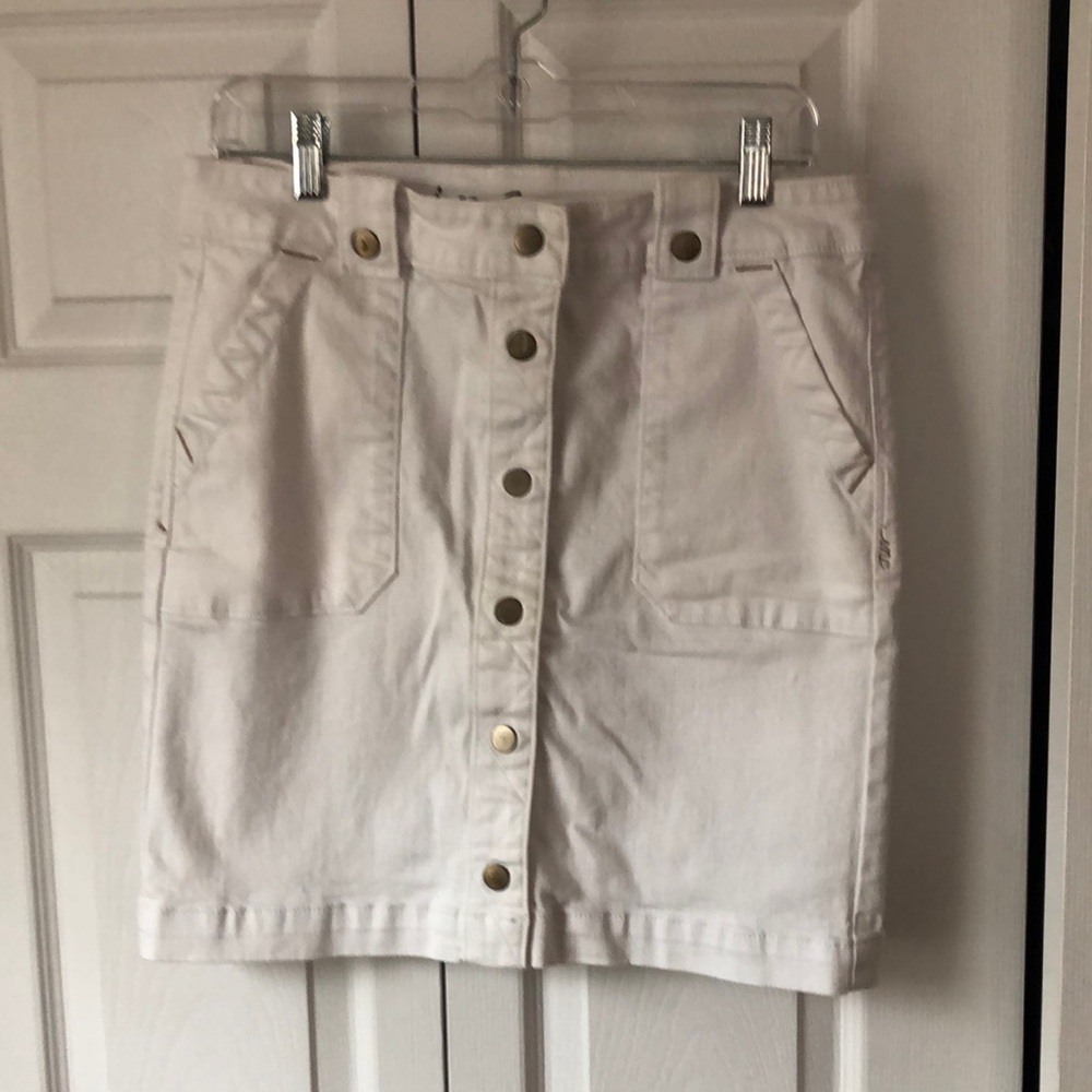 Denim mini skirt with front snap details. Stretchy and comfy! Like new!